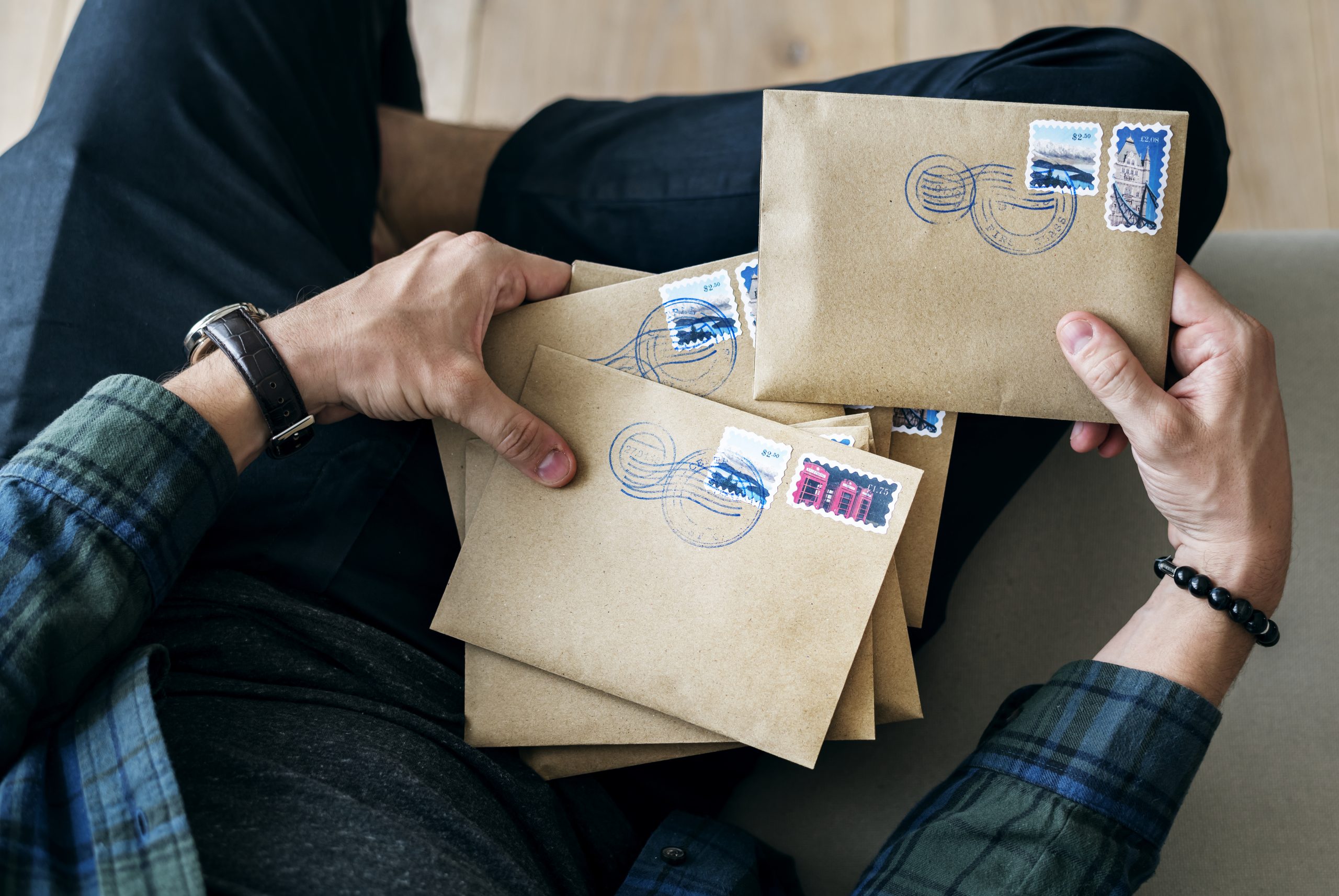 Aerial view of a man sorting an envelope